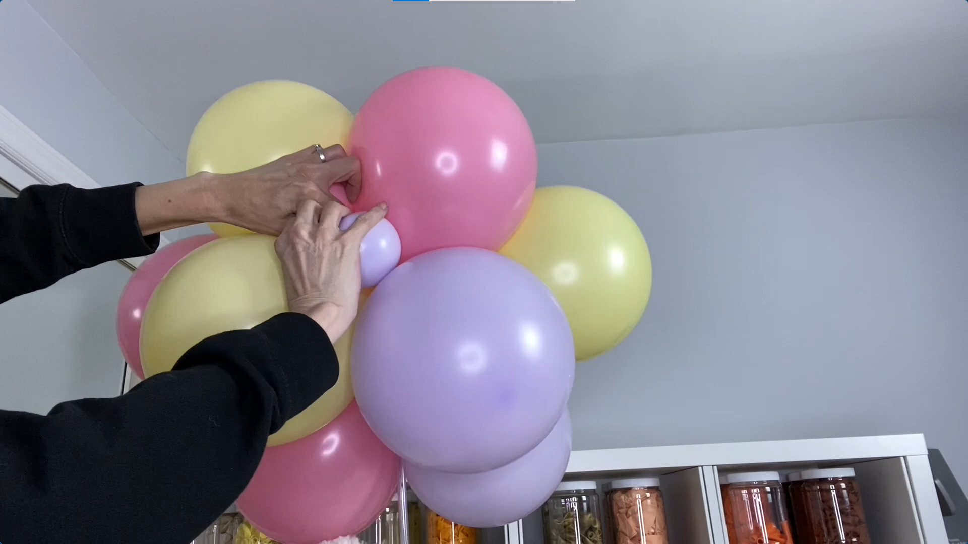 Pink, yellow, and purple balloons