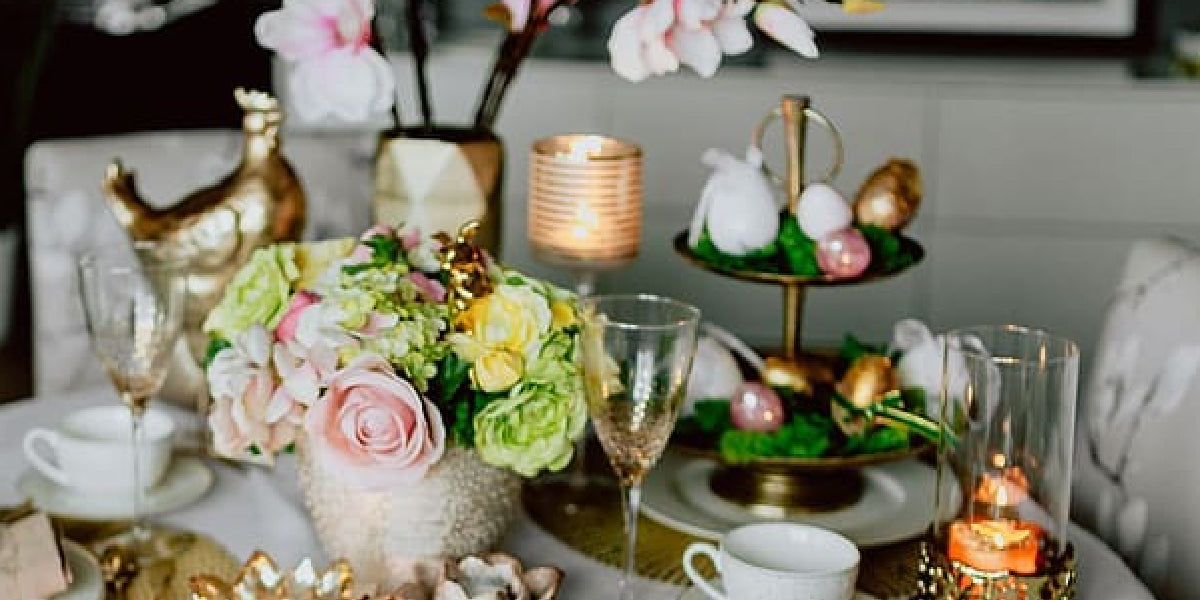 DIY centerpiece ideas: Floral arrangement, candles, and ornaments on a festive table setting
