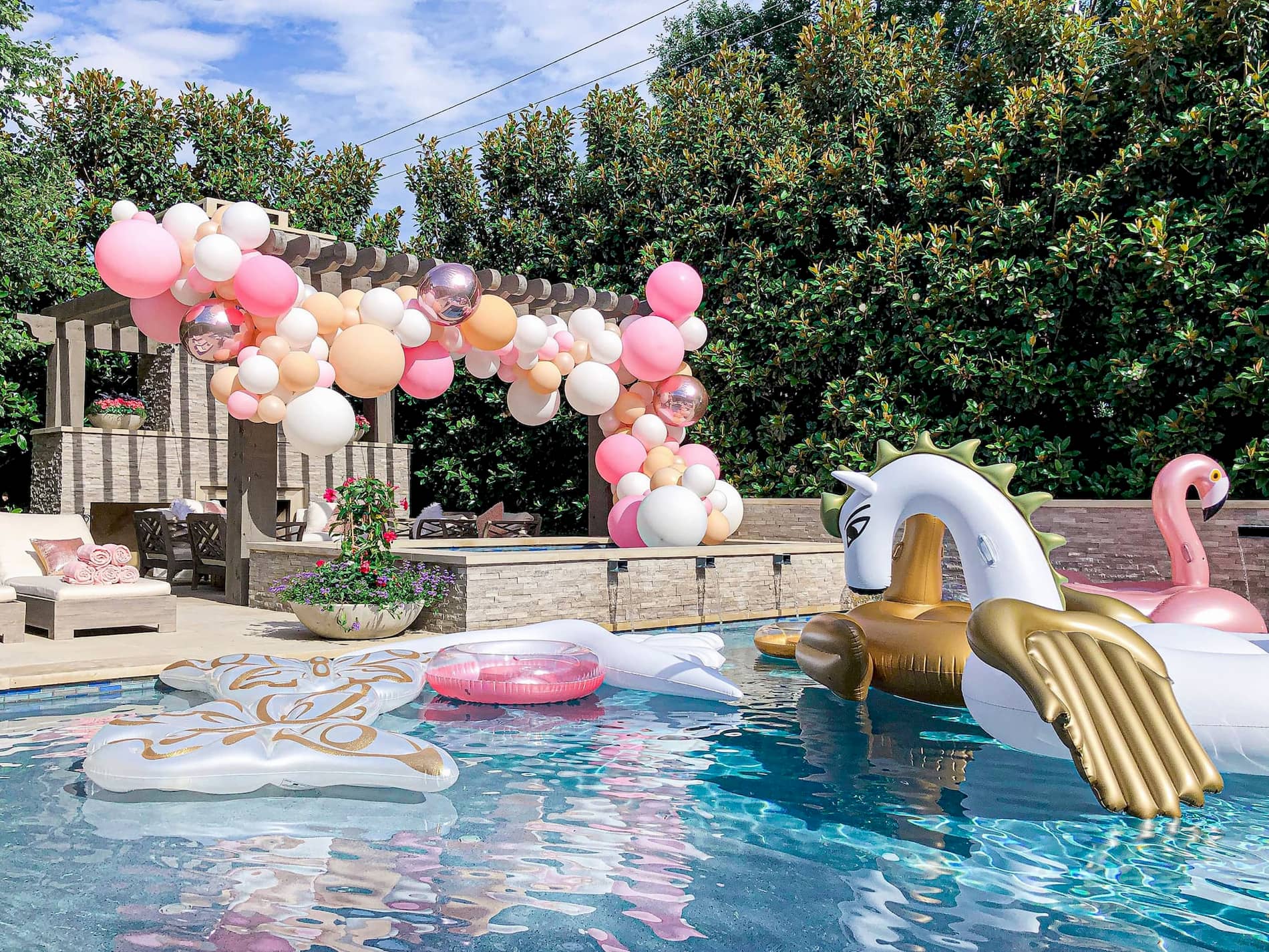 Balloon arch display by the pool