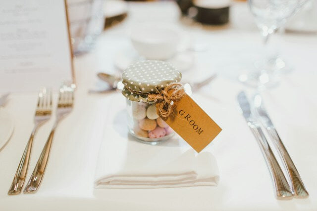 Glass container with a personalized tag