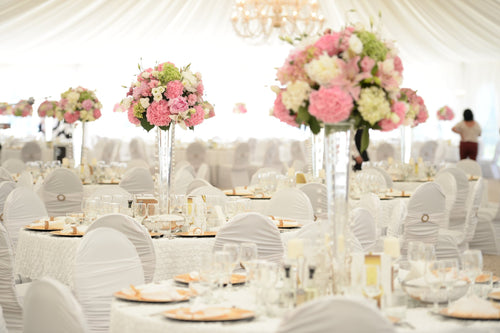 dinner table with tablecloths, chair covers and chair sashes