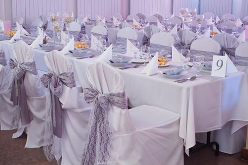 banquet table with tablecloths, chair covers and chair sashes