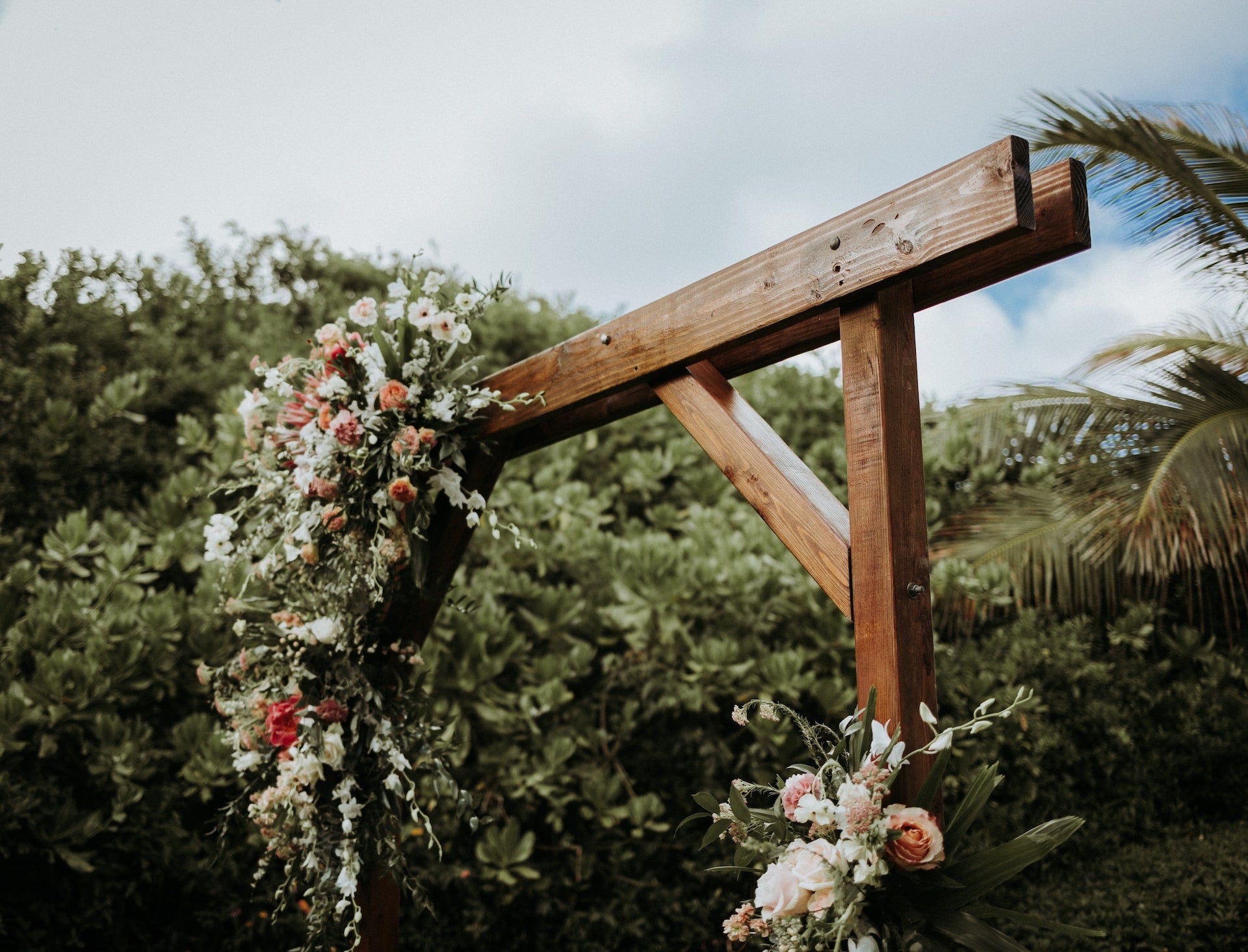 Wooden wedding arch with flowers