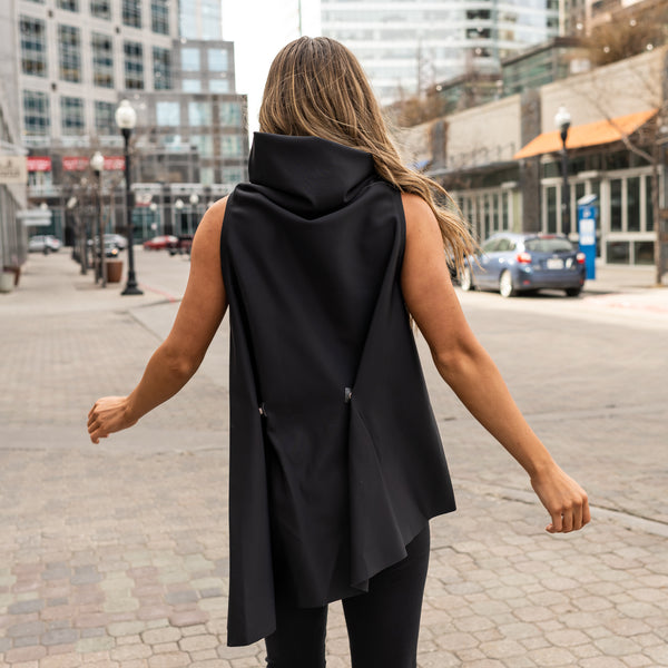 A black asymmetrical sustainable vest by Malaika New York. A true staple piece for your sustainable capsule wardrobe