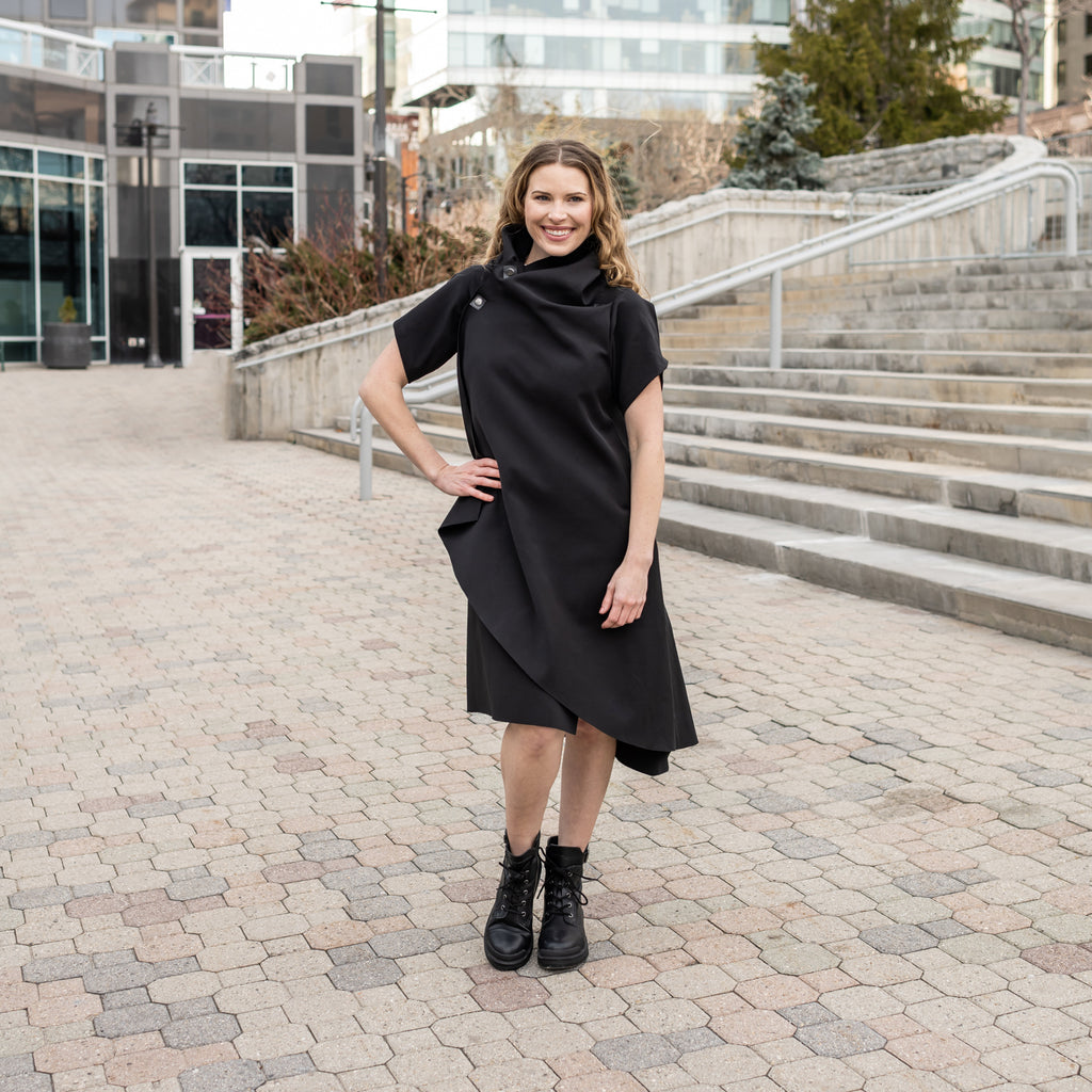 A woman wearing an asymmetrical vest by Malaika New York in a asymmetrical vest