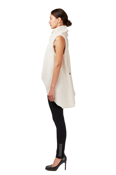 Woman wearing a Faux fur asymmetrical vest by Malaika New York