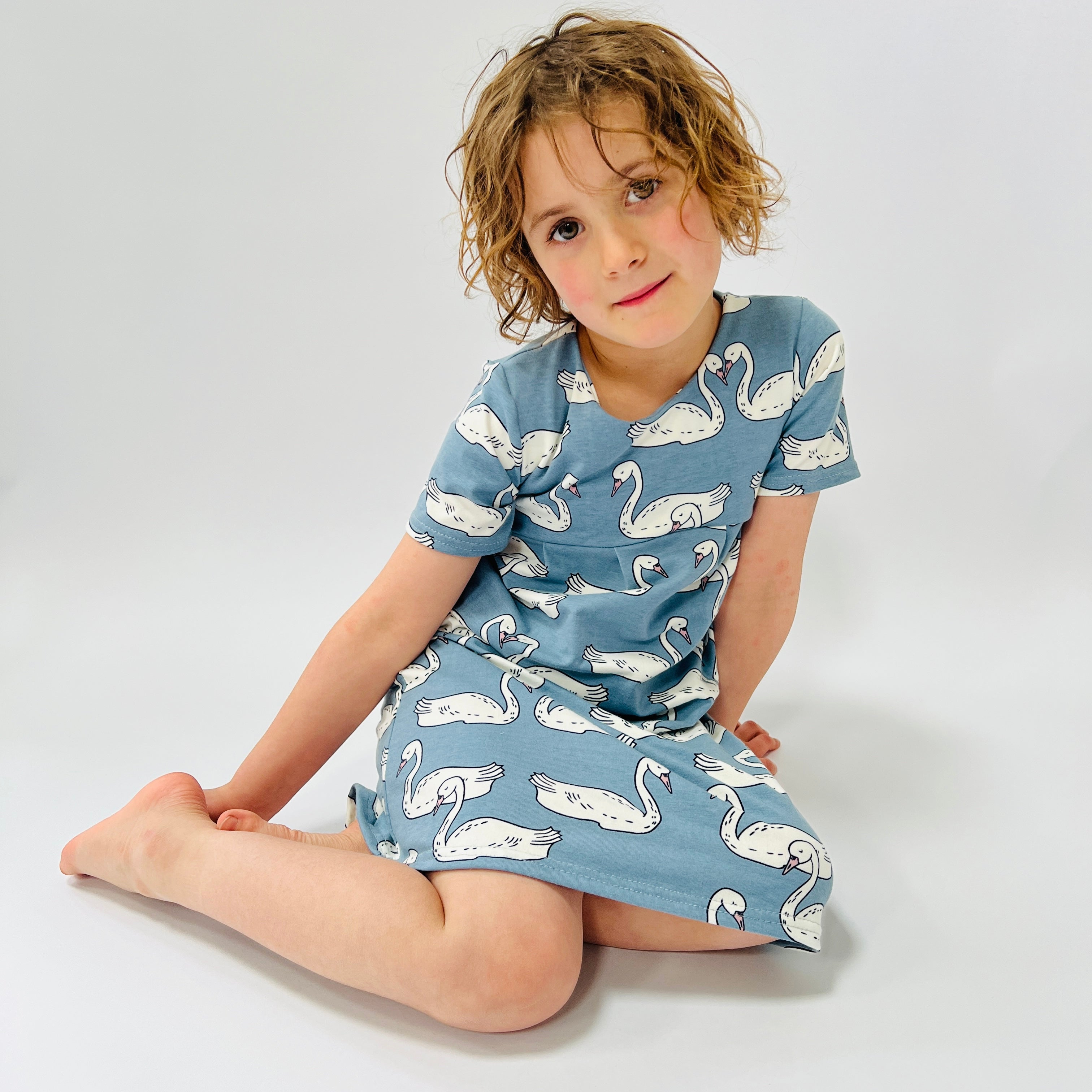 Eddie & Bee organic cotton short sleeved dress in Blue “Swan Lake” print