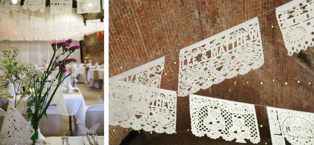 personalised wedding bunting white; nice tables; brick ceiling white flags