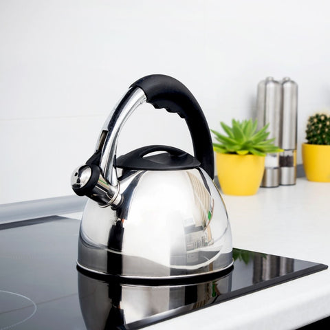 silver kettle sitting on white kitchen counter top