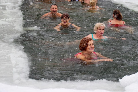 Group Of People swimming in an icy pool