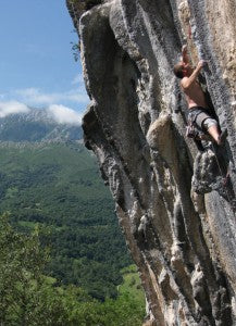 The-author-climbing-on-the-amazing-tufas-of-Poo-de-Cabrales