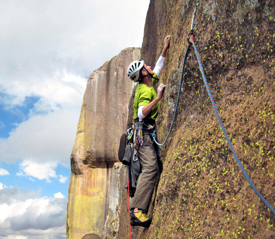 Rock climber wearing Tenaya climbing shoes