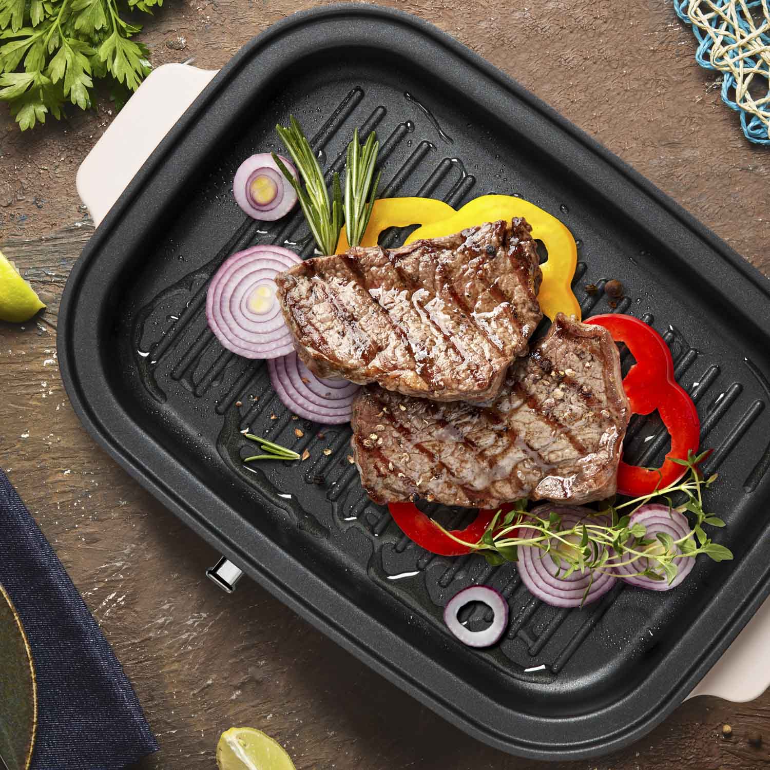 Ventray grill with steak, onions, bell peppers