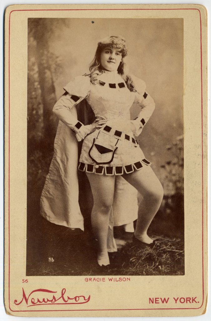 1890 Gracie Wilson. in costume with cape.