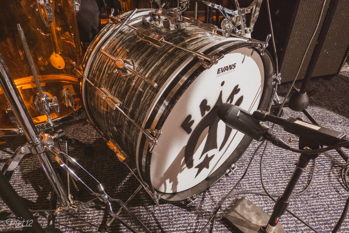 Bailey Minzenberger's drum set, featuring Friko's logo.