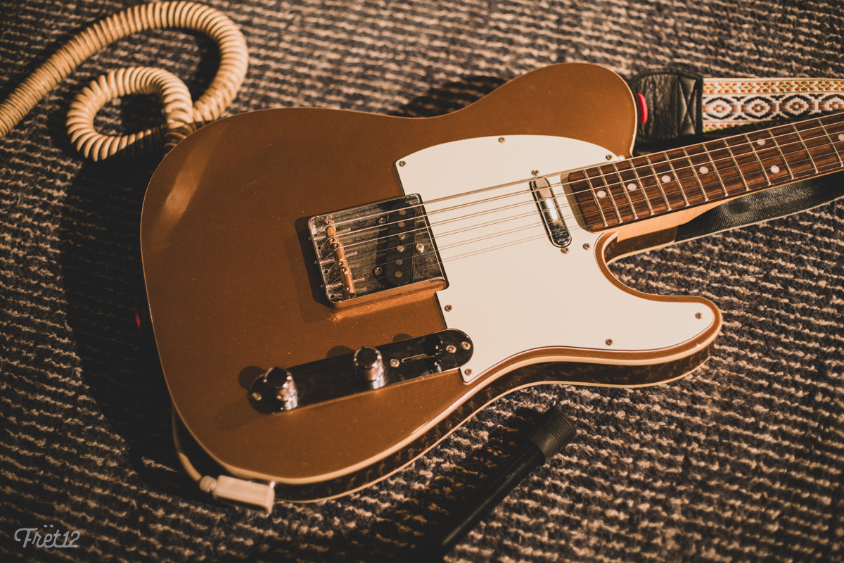 Cody Palmer's gold Fender JV Modified Tele and pick.