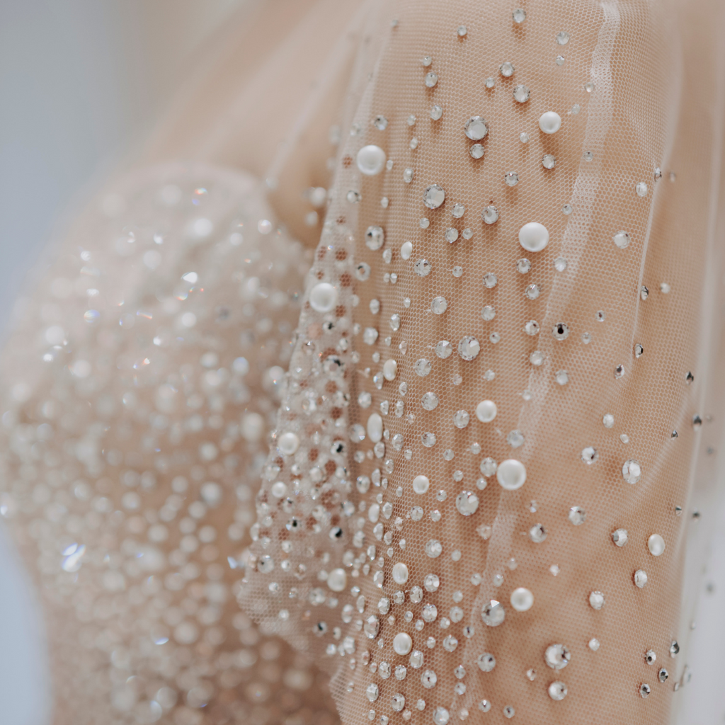 adding embellishments to wedding dress