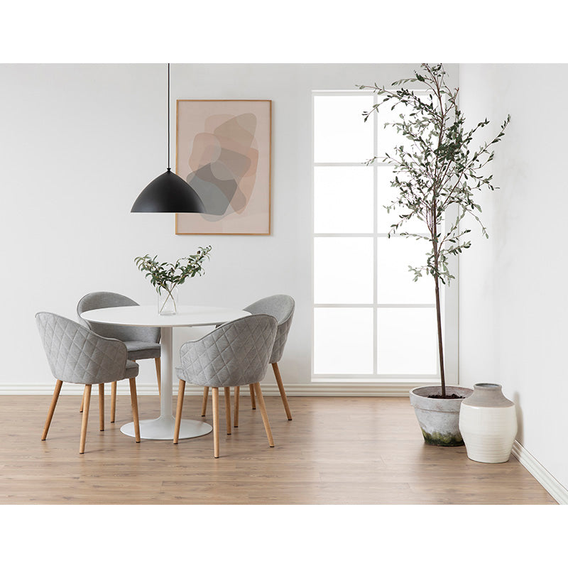 round dining table with white chairs