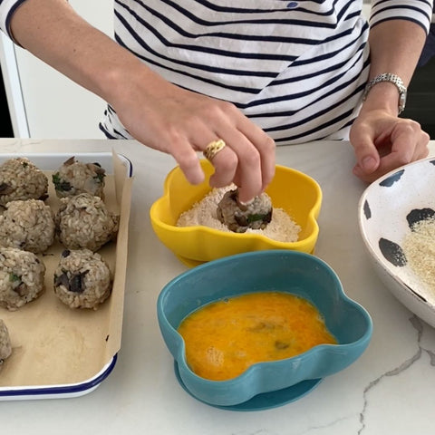 roll risotto balls in breadcrumbs and egg