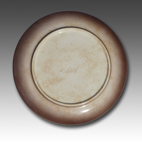 each plate is signed on the back