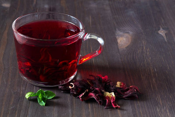 https://cdn.shopify.com/s/files/1/1559/1001/products/whole-hibiscus-flowers-tea-steep-no-h365-by-steepologie-710429_600x.jpg?v=1698935846