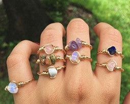 Female Hand Wearing Gemstones for Maximalist Look