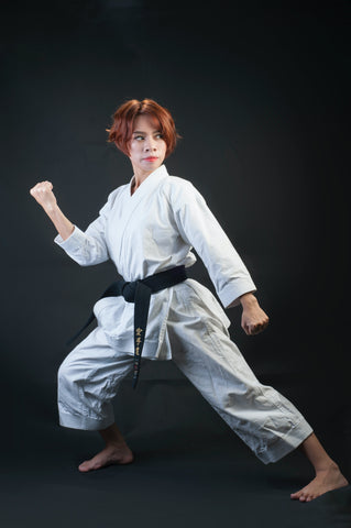 Woman Practicing Karate in Stance for Protection