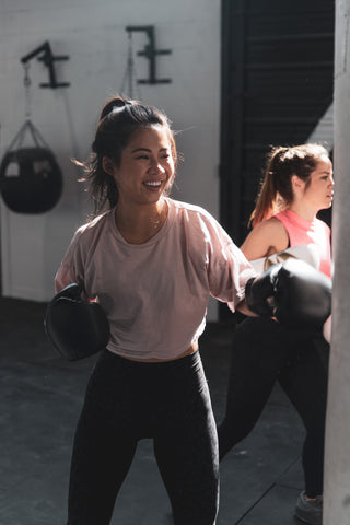 Girl Practicing Punching in Kickboxing Class for Self Defence