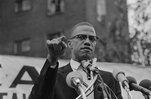 Malcolm X Giving Speech Outdoors