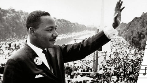 Martin Luther King, Jr. Giving Speech Outdoors with Hand Raised