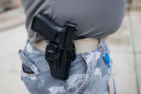 Man Carries Handgun in Holster on Hip