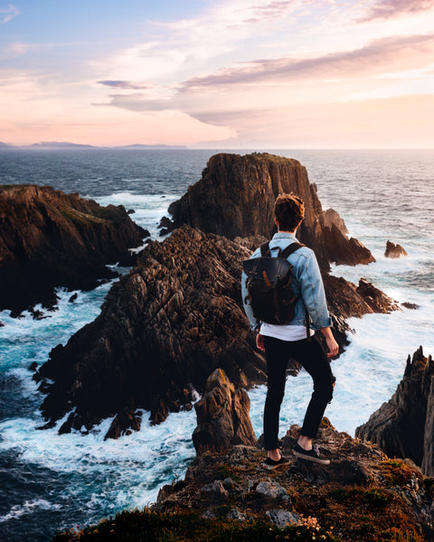 Man with Backpack Solo Traveling to Beautiful Ocean