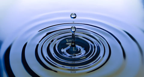 drop atop water ripples