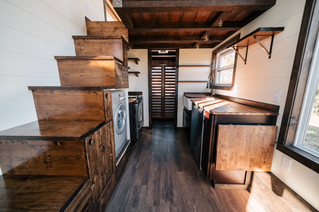 Silhouette Tiny House on Wheels with a Crossfit Gym by Wind River Tiny Homes