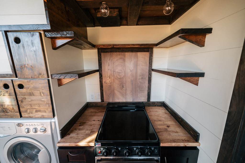 Silhouette Tiny House on Wheels with a Crossfit Gym by Wind River Tiny Homes