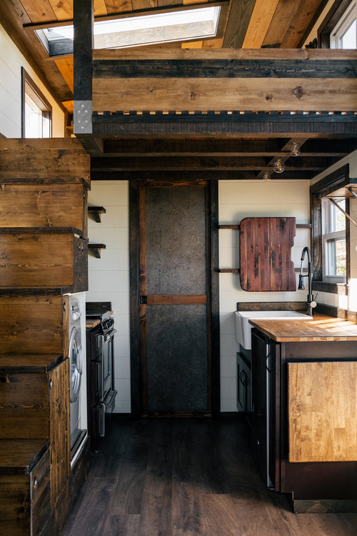 Silhouette Tiny House on Wheels with a Crossfit Gym by Wind River Tiny Homes