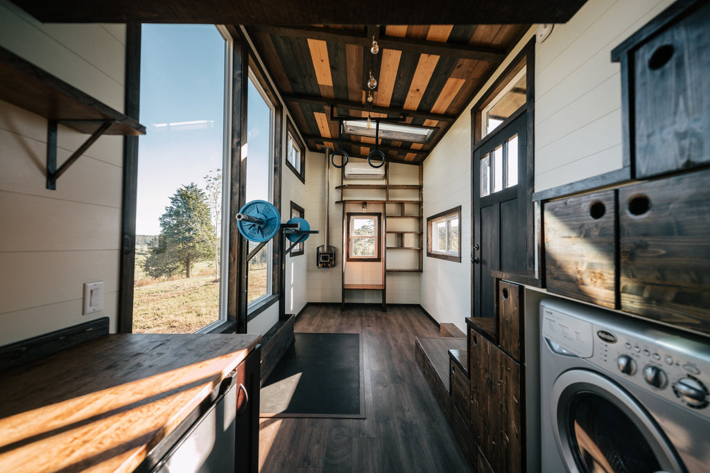 Silhouette Tiny House on Wheels with a Crossfit Gym by Wind River Tiny Homes