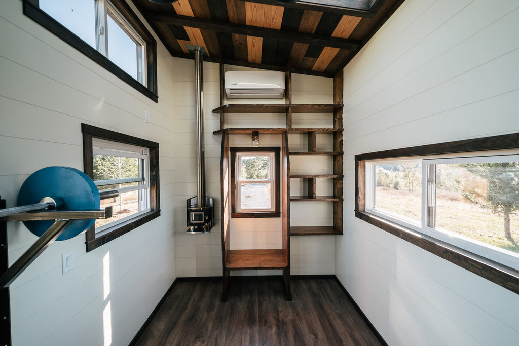 Silhouette Tiny House on Wheels with a Crossfit Gym by Wind River Tiny Homes