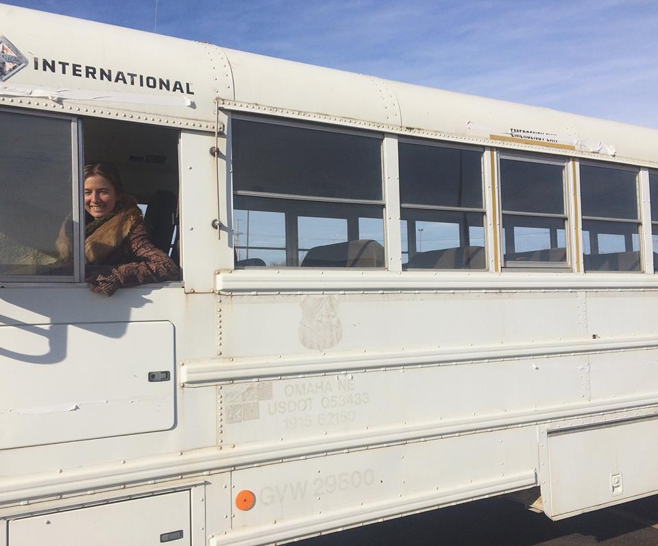 Dani Gallagher and her restored school bus, the Roaming Soul Apothecary