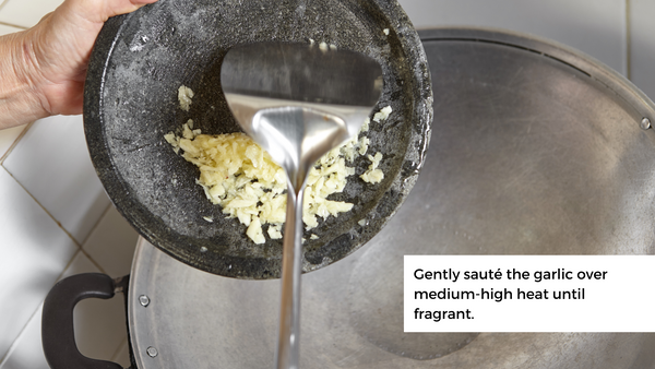 gently sauté the garlic over medium-high heat until fragrant. Once aromatic, remove it from the pan and discard