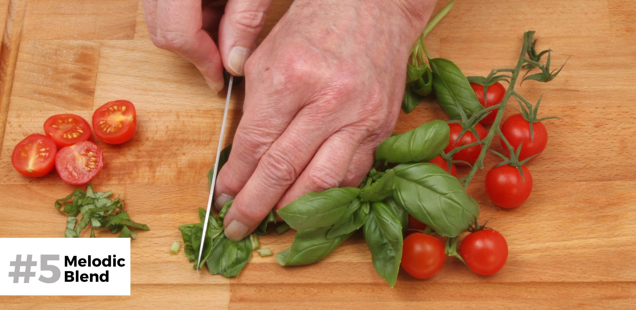 Cutting tomatoes and basil for the Bruschetta topping