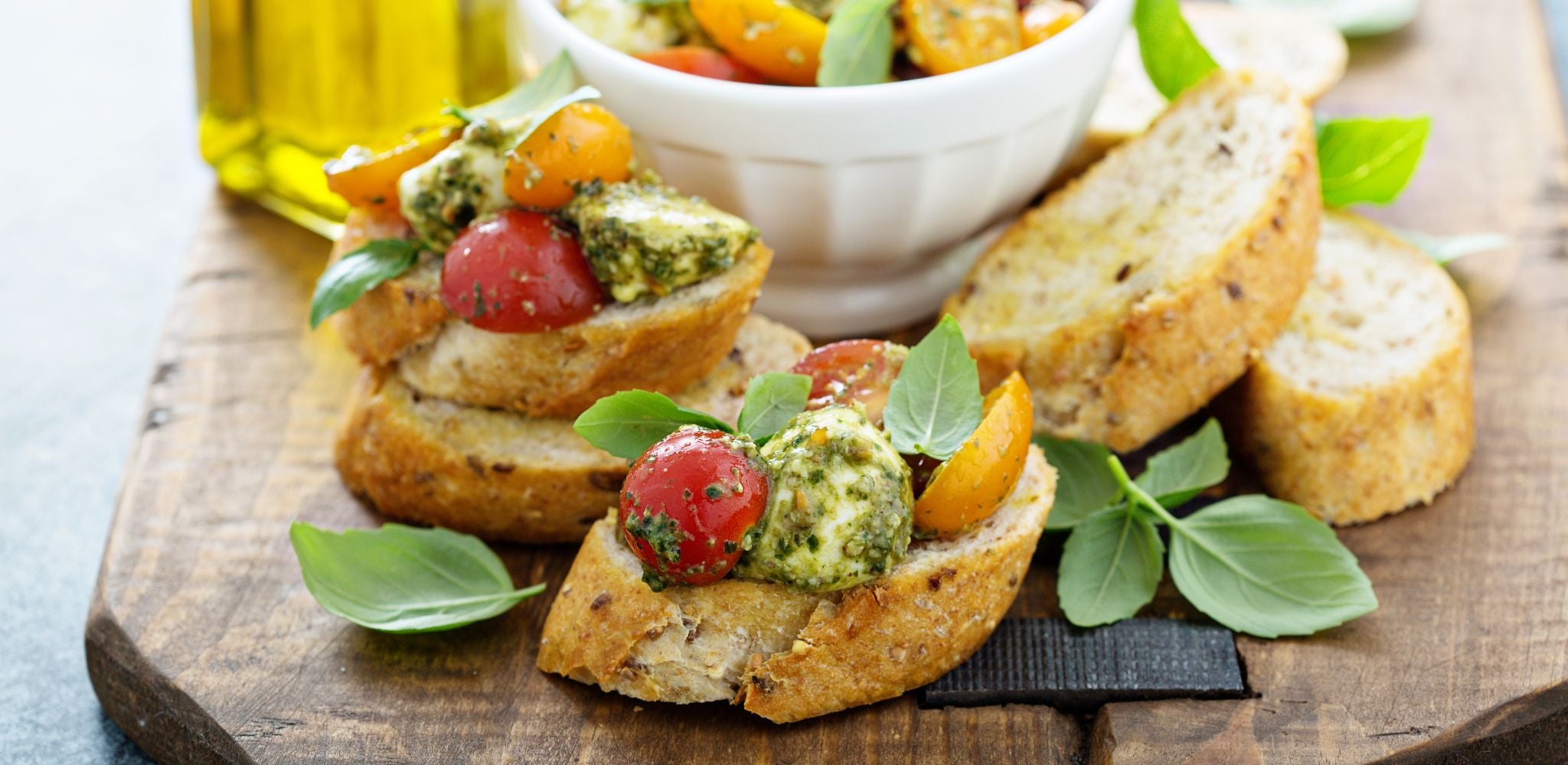 Fancy bruschetta with bocconcini and pesto sauce