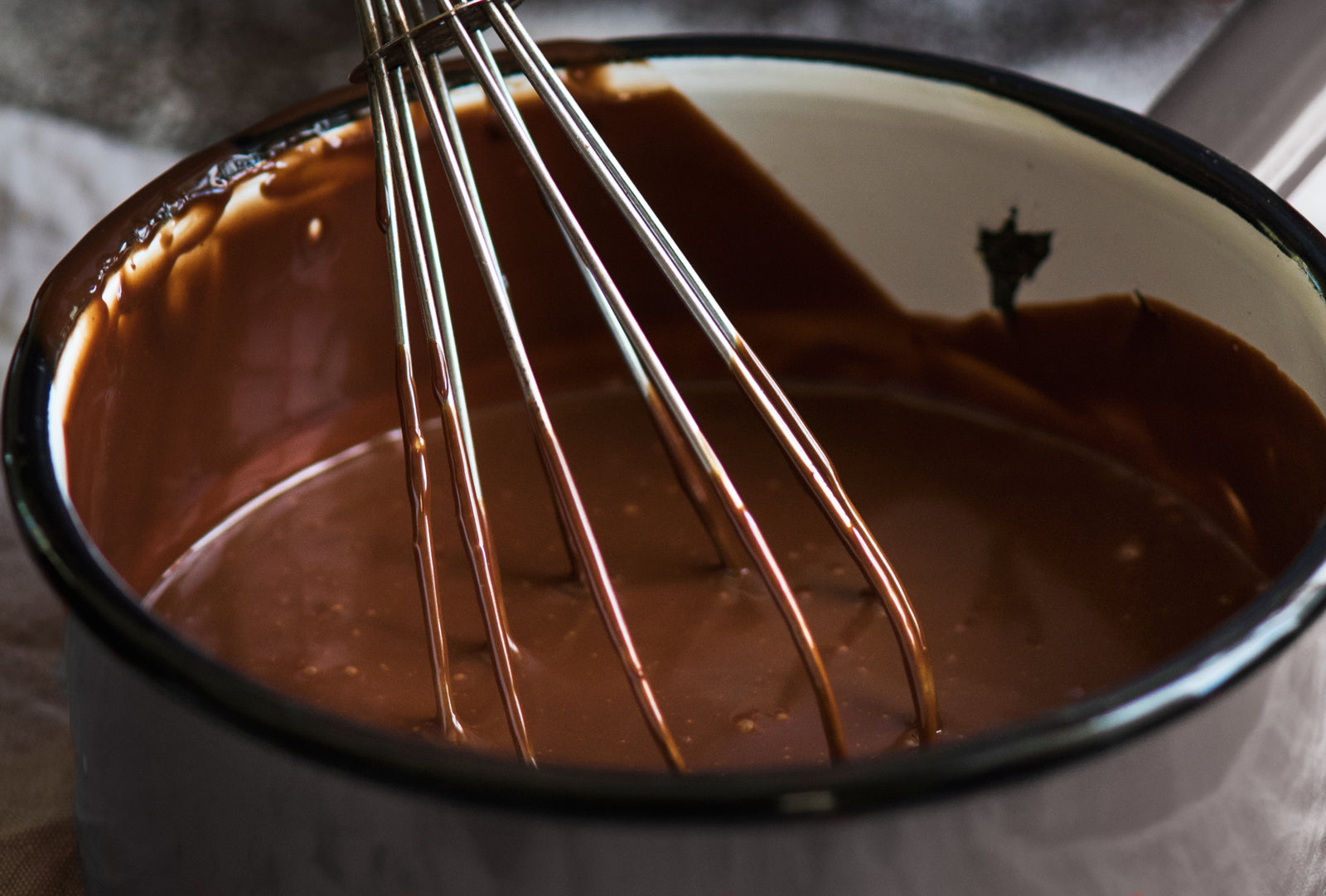 chocolate ganache in pot for chocolate tarts