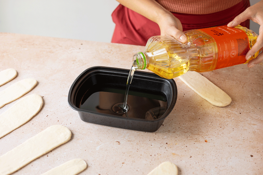 coating dough pieces in oil