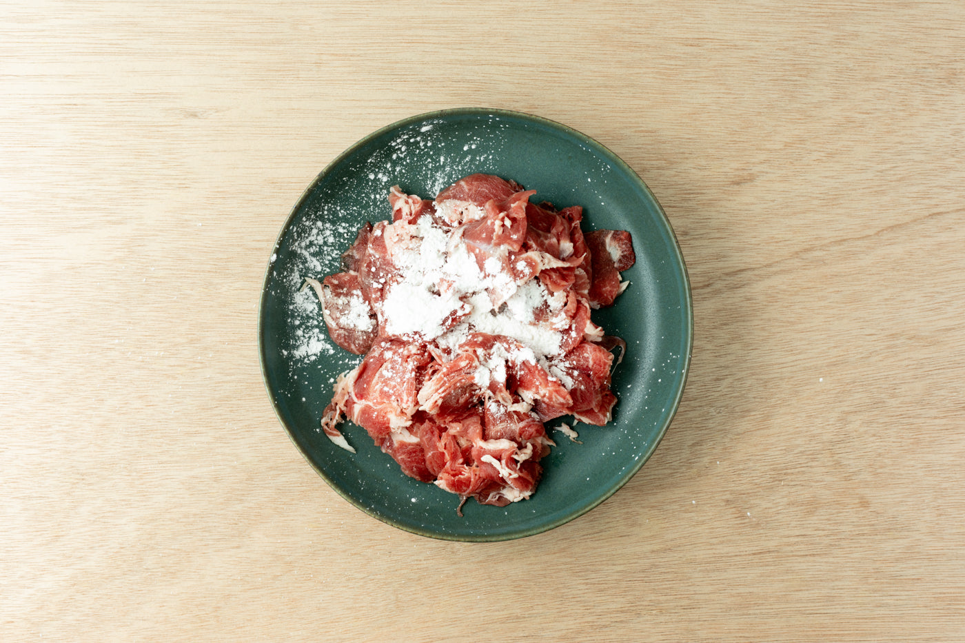 thinly sliced lamb with cornstarch for biang biang noodle recipe