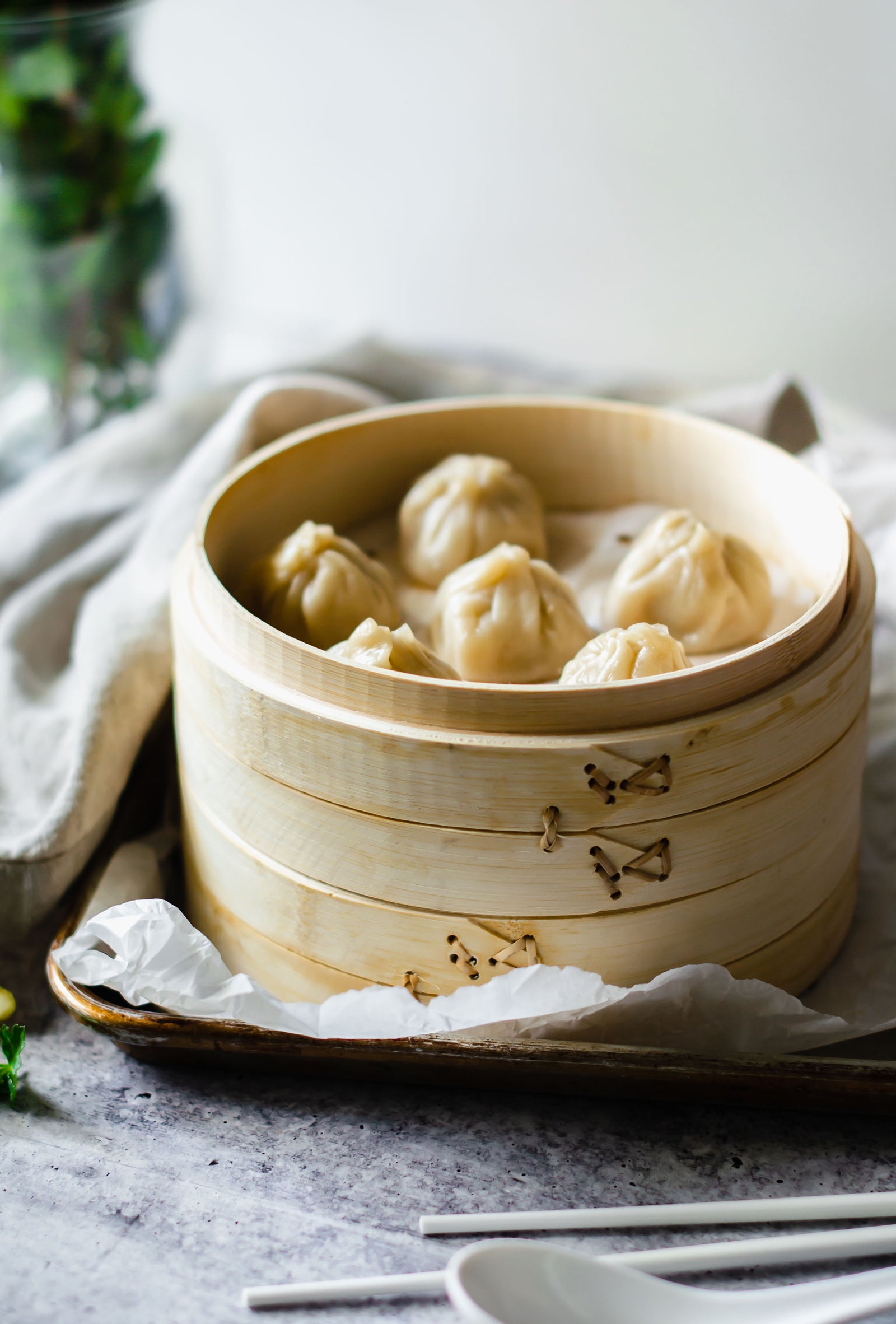 Xiao Long Bao being in a bamboo steamer 