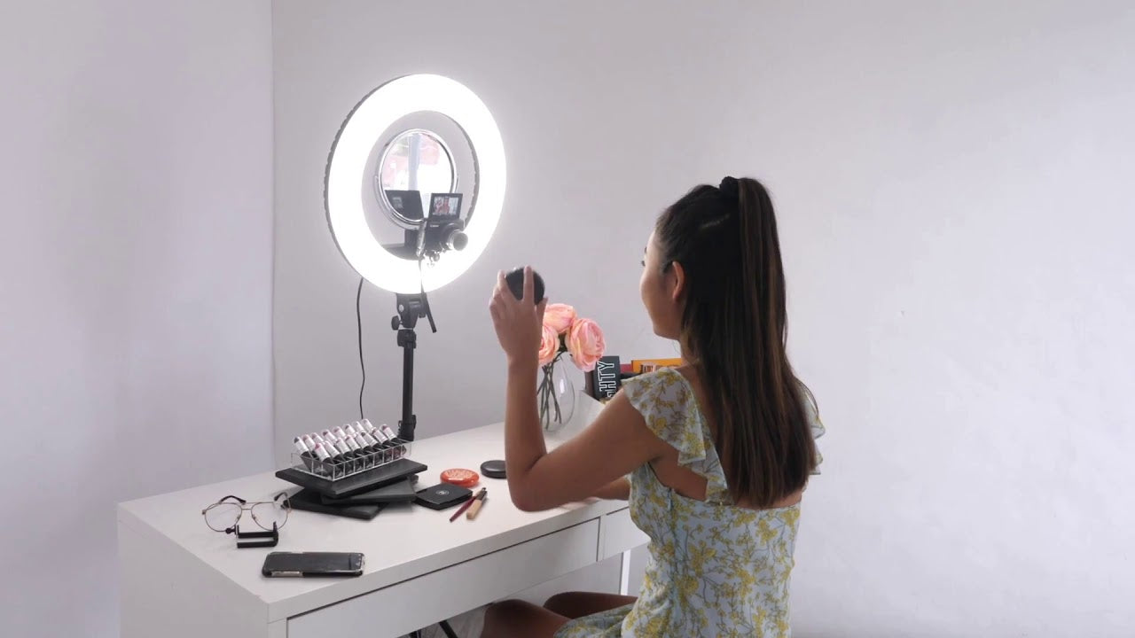 The Etoile Collective IlluminateMe Ring Light. Featuring a camera and mirror attached to the ring light.