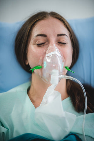 woman with asthma wheezing with nebuliser