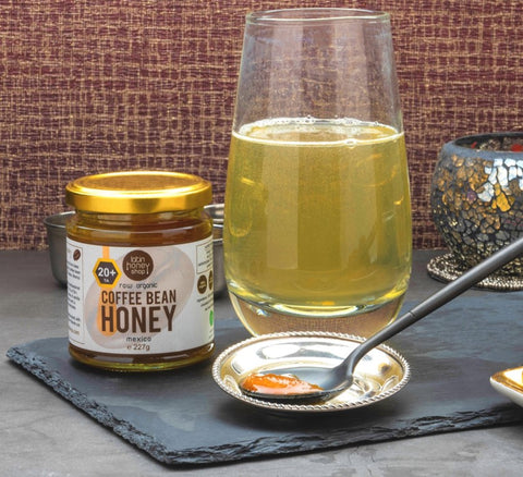 Raw organic coffee bean honey with water
