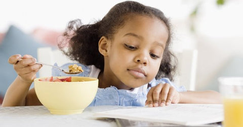 child eating healthy breakfast